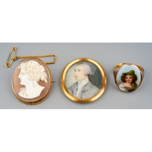 35 - A Victorian yellow metal cameo brooch; a 9ct yellow gold ring, set with a continental porcelain plaq... 