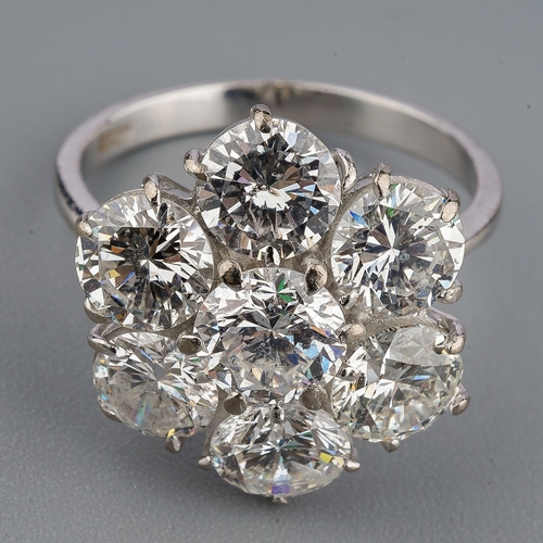 36 - A diamond cluster ring, set with seven round brilliant cut diamonds, estimated total diamond weight ... 