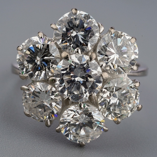 36 - A diamond cluster ring, set with seven round brilliant cut diamonds, estimated total diamond weight ... 