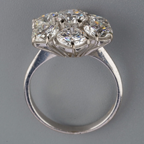 36 - A diamond cluster ring, set with seven round brilliant cut diamonds, estimated total diamond weight ... 