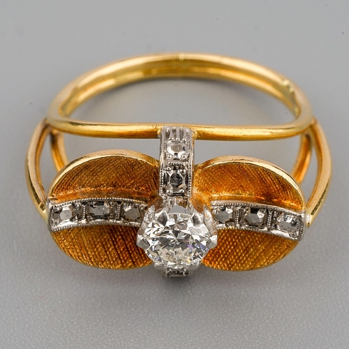 46 - A mid 20th century diamond dress ring, set with a round brilliant cut diamond, claw set to the textu... 