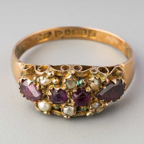 63 - A gem set ring, the Georgian from set with garnet, seed pearl and imitation pearl, to the later adde... 