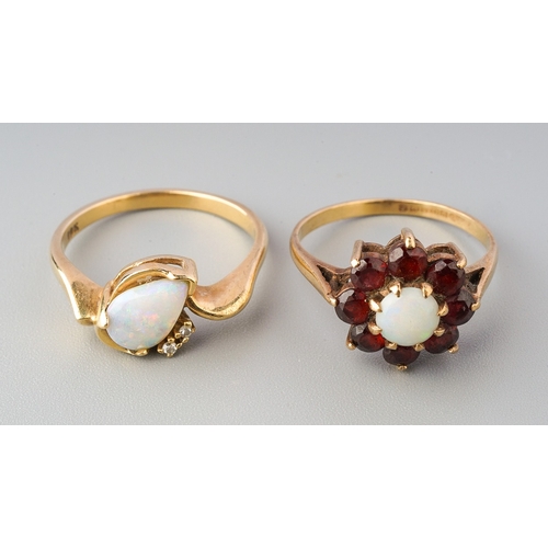 70 - Two gem-set rings, to include a pear-shape opal cabochon dress ring with single cut diamond accents,... 