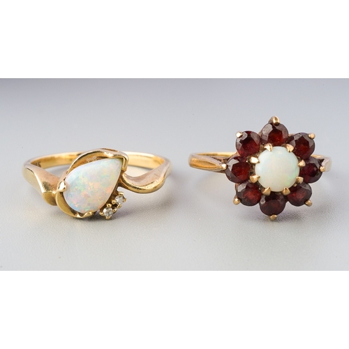 70 - Two gem-set rings, to include a pear-shape opal cabochon dress ring with single cut diamond accents,... 