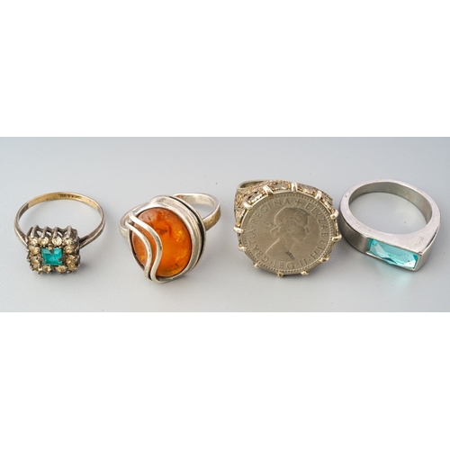 72 - Collection of 4 rings to include silver coin ring, silver amber ring etc. (4)