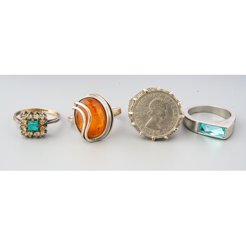 72 - Collection of 4 rings to include silver coin ring, silver amber ring etc. (4)