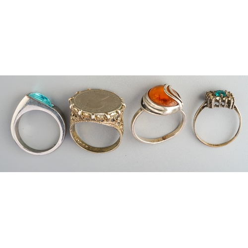 72 - Collection of 4 rings to include silver coin ring, silver amber ring etc. (4)