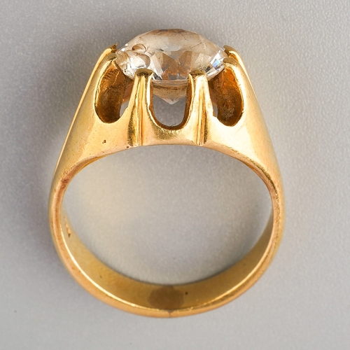 73 - A gem set single stone ring, set with a circular-shape mixed cut rock crystal, within an extended ei... 