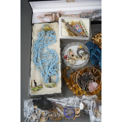 79 - Large collection of costume jewellery to include  silver chain, silver shell pendant, coral necklace... 