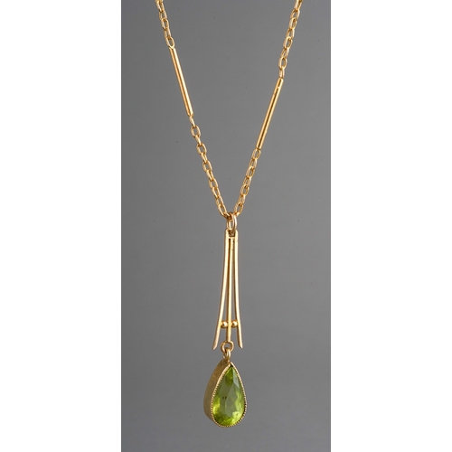 82 - Yellow metal peridot set pendant on chain. Faint 9 ct gold marks to clasp. Gross weight 5.3g