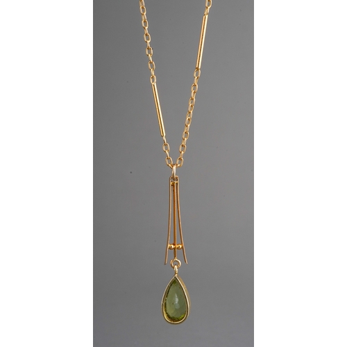 82 - Yellow metal peridot set pendant on chain. Faint 9 ct gold marks to clasp. Gross weight 5.3g