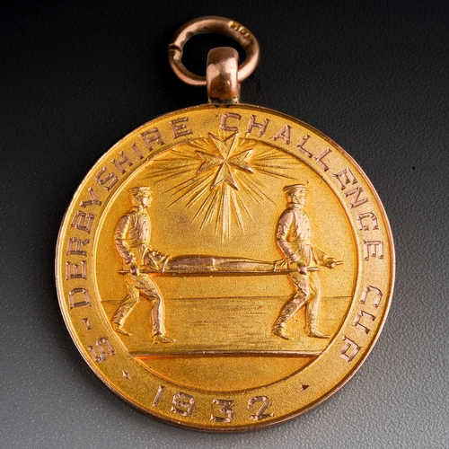 84 - A George V 9ct gold medal for Derbyshire Challenge Cup 1932, awarded to S Leicester Colliery E Willi... 