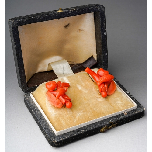 86 - A pair of antique coral earrings with antique case, each earring designed as branch and carved coral... 