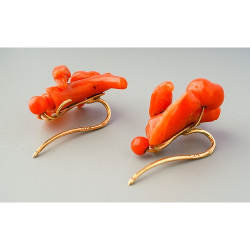 86 - A pair of antique coral earrings with antique case, each earring designed as branch and carved coral... 