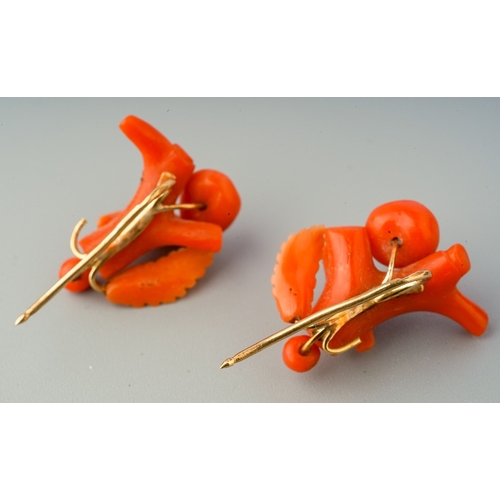 86 - A pair of antique coral earrings with antique case, each earring designed as branch and carved coral... 