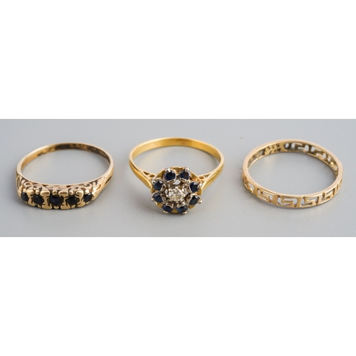 97 - A selection of three rings, to include a an 18ct gold diamond and sapphire cluster ring, hallmarked ... 