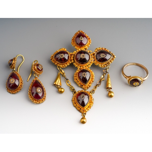 99 - An early 19th century yellow metal, garnet and split seed pearl and white stone set to include  pend... 