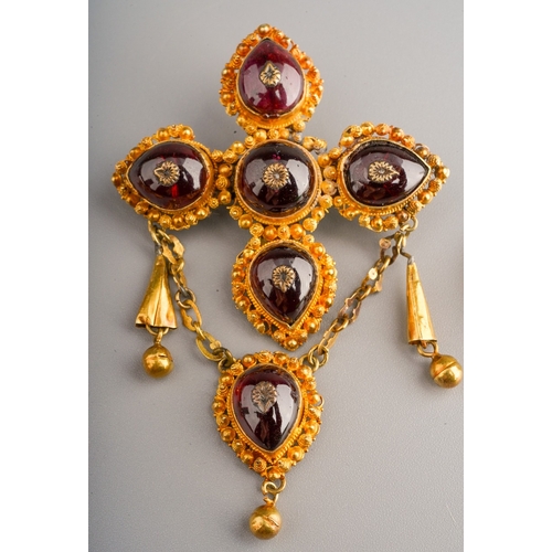 99 - An early 19th century yellow metal, garnet and split seed pearl and white stone set to include  pend... 