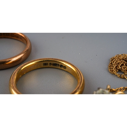 104 - Two 9 ct gold wedding bands, further 9 ct gold ring and a 9 ct gold chain. Gross weight 7.1g