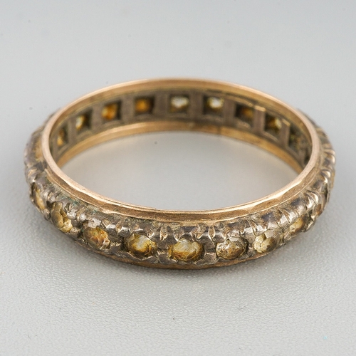 114 - A paste set yellow and white metal eternity ring, set with colourless paste, stamped sil 9ct, approx... 