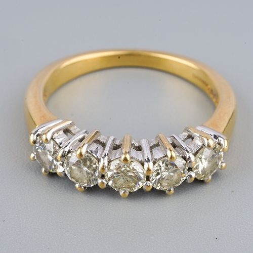 121 - An 18ct gold diamond five stone ring, set with round brilliant cut diamonds, estimated/ stated diamo... 