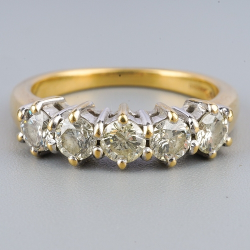 121 - An 18ct gold diamond five stone ring, set with round brilliant cut diamonds, estimated/ stated diamo... 