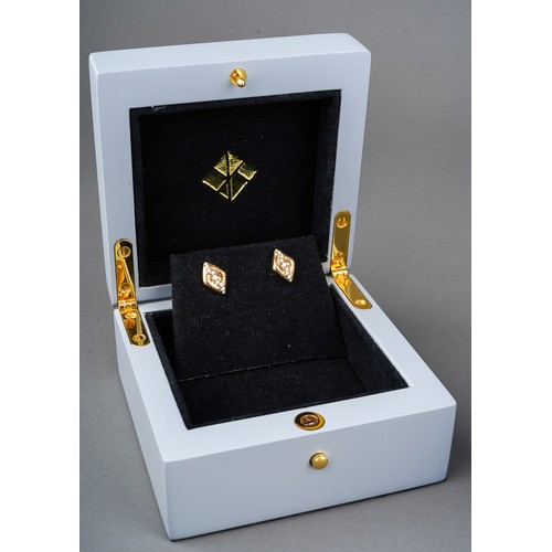 126 - A pair of Kat Florence 18 ct gold earrings set with 18 round brilliant cut D flawless diamonds. Come... 