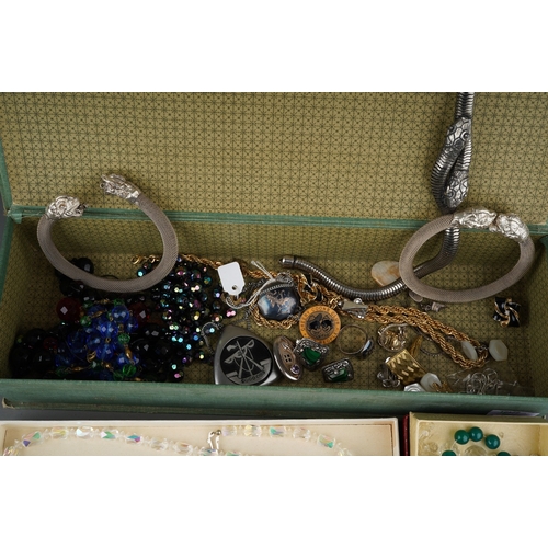 128 - Box with costume jewellery to include white metal bangles, snake necklace, silver and green stone ea... 