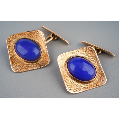 143 - Pair of yellow metal cufflinks each set with an oval blue glass cabochon measuring approximately 15 ... 