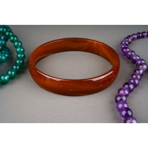 145 - Solid agate bangle, amethyst necklace and 2 further green glass ( possibly malachite) necklaces