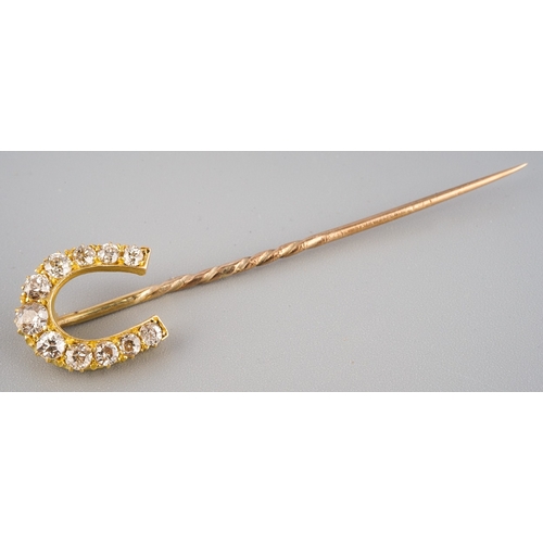 150 - A late Victorian diamond set tie pin of horseshoe design, set with 11 old European cut diamonds, cla... 