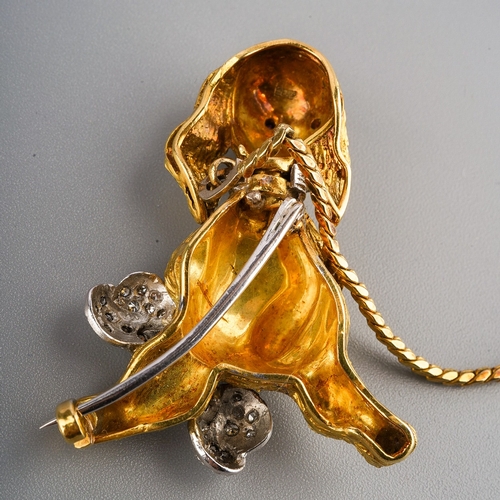 153 - An 18ct gold novelty dog brooch, designed with an articulated head with red gem set eyes, diamond se... 