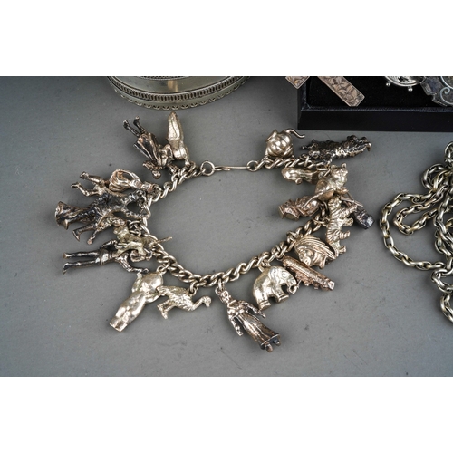 165 - Collection of silver jewellery to include silver bangle, brooches, cross, white metal yard chain and... 