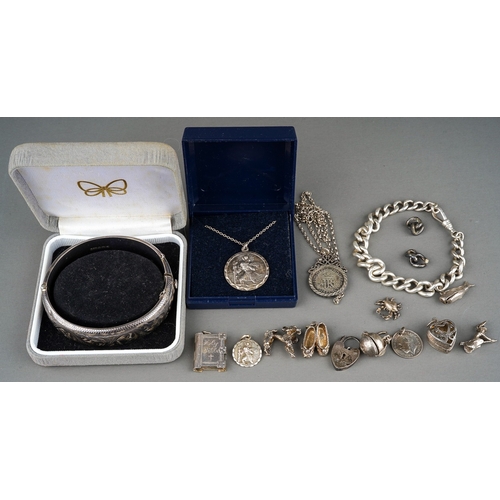 188 - Collection of silver to include silver St Nicholas on a silver chain, silver bangle, silver charm br... 