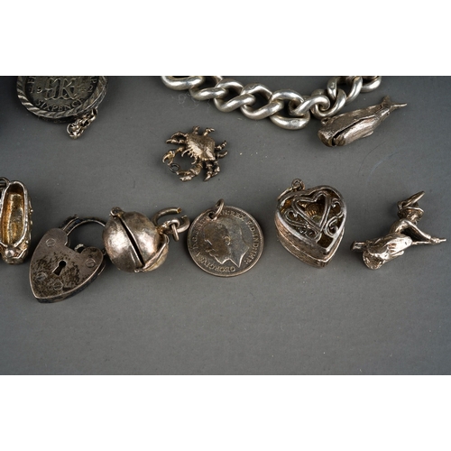 188 - Collection of silver to include silver St Nicholas on a silver chain, silver bangle, silver charm br... 