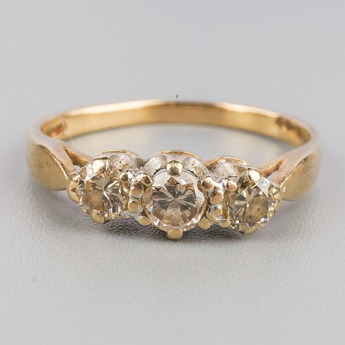 191 - A 9ct gold diamond three stone ring, set with graduating round brilliant cut diamonds, hallmarked 9c... 