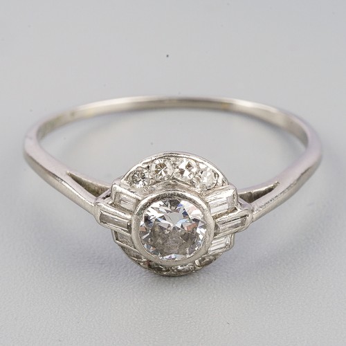 193 - A diamond cluster ring, set with an early brilliant cut diamond, rubover set, single cut diamond bor... 