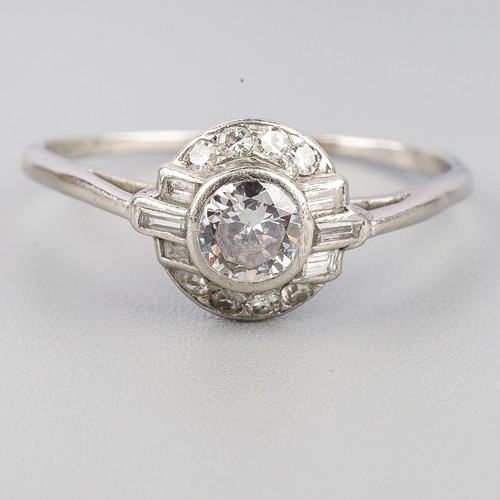 193 - A diamond cluster ring, set with an early brilliant cut diamond, rubover set, single cut diamond bor... 