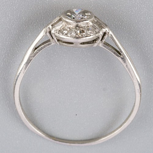 193 - A diamond cluster ring, set with an early brilliant cut diamond, rubover set, single cut diamond bor... 