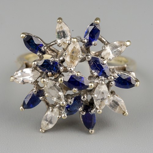 196 - A 9ct white gold gem set ring, set with synthetic blue sapphire and colourless spinel, to the plain ... 