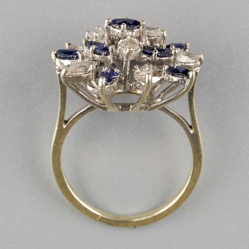 196 - A 9ct white gold gem set ring, set with synthetic blue sapphire and colourless spinel, to the plain ... 