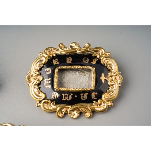 197 - Collection of mourning brooches to include 3 enamelled examples - one dated 1852 and set with moss a... 