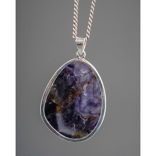 200 - A large silver mounted blue john pendant on silver chain. Stone measures approx. 4 x 3 cm