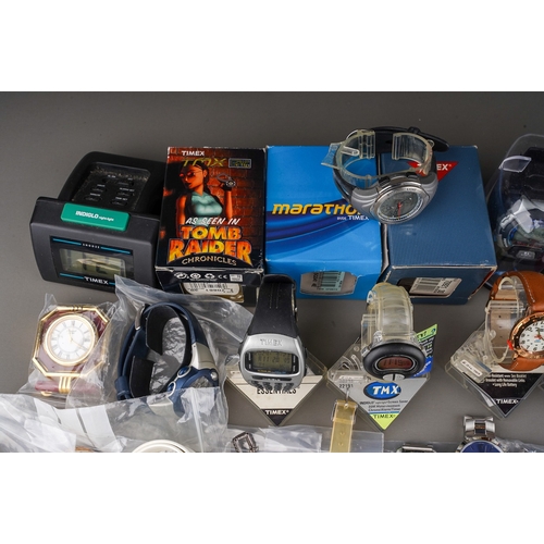 227 - A large collection of ex shop stock watches include digital watches mainly Timex including Power Fig... 