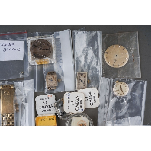 238 - Collection of assorted Omega and Rolex watch parts including movements , replacement parts, dials, g... 