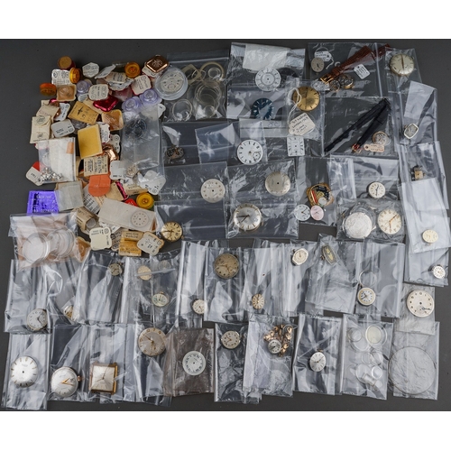 239 - Large collection of assorted watch parts - to include movements, glass, replacement parts, faces etc... 