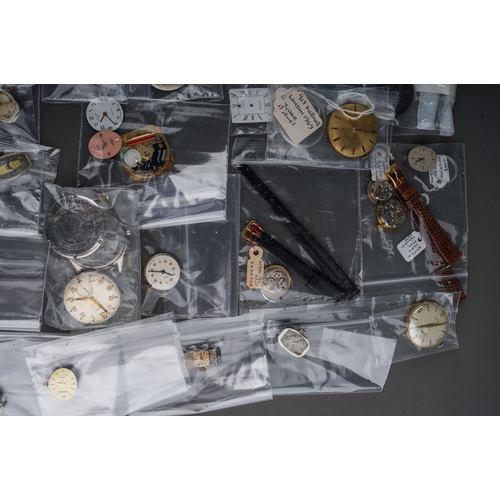 239 - Large collection of assorted watch parts - to include movements, glass, replacement parts, faces etc... 