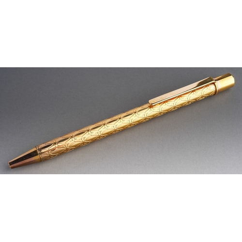 252 - Cartier - a gold-plated roller ball pen, in fitted presentation box