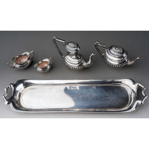 256 - An Elizabeth II silver miniature four piece Georgian style tea and coffee service on twin handled tr... 