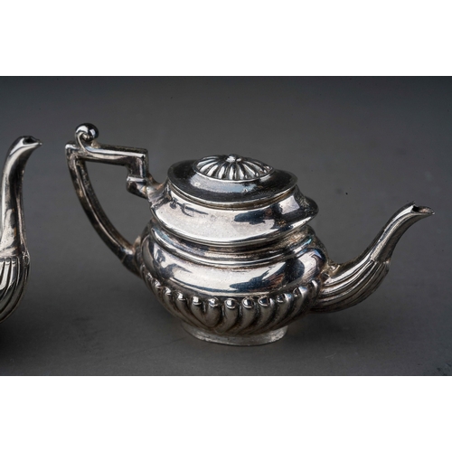 256 - An Elizabeth II silver miniature four piece Georgian style tea and coffee service on twin handled tr... 